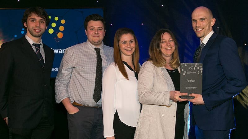 Mary Dempsey, Senior Lecturer in Mechanical Engineering at NUI Galway presents the Young Leader of the Year award to Dr. Russell McLaughlin and Trinity College Dublin team.