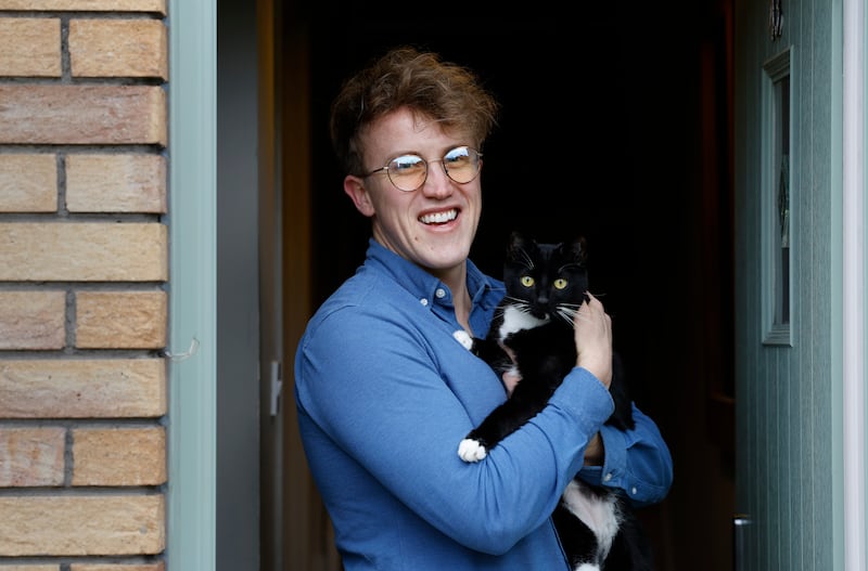 Samuel Rogers with his cat, Atse. Photograph: Nick Bradshaw 