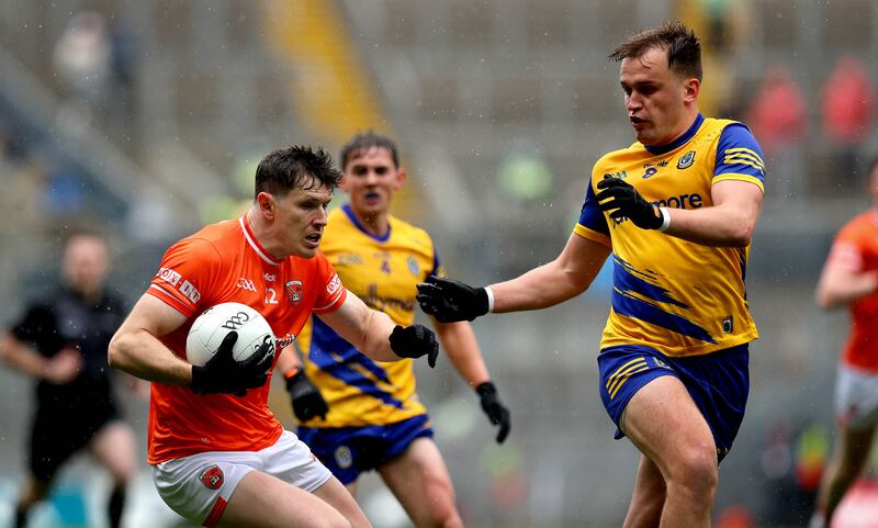 Armagh’s Joe McElroy and Enda Smith of Roscommon. Photograph: Ryan Byrne/Inpho