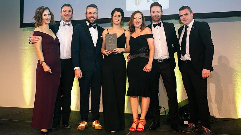 Ciaran O’Hagan, Managing Director, Specialist Joinery Group presents the Excellence in Sustainability award to O'Connor Sutton Cronin (M&E) team