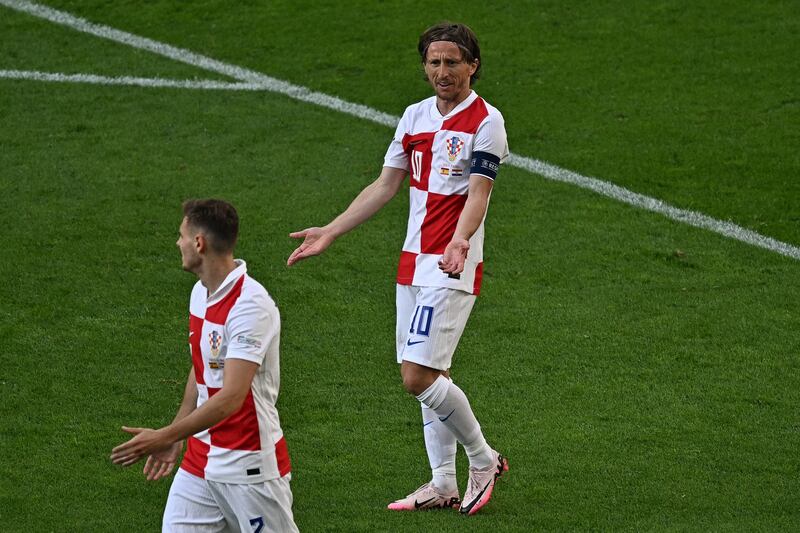 Croatia midfielder Luka Modric gestures to team-mate Josip Stanišić during the Euro 2024 game against Spain in Berlin. Photograph: Gabriel Bouys/AFP via Getty Images
