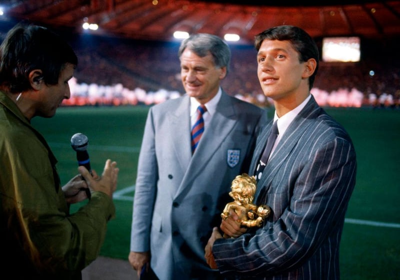 Football World Cup 1990, Gary Lineker is presented with his fairplay trophy as Jim Rosentahl talks to Bobby Robson. Photograph: Mark Leech/Getty Images