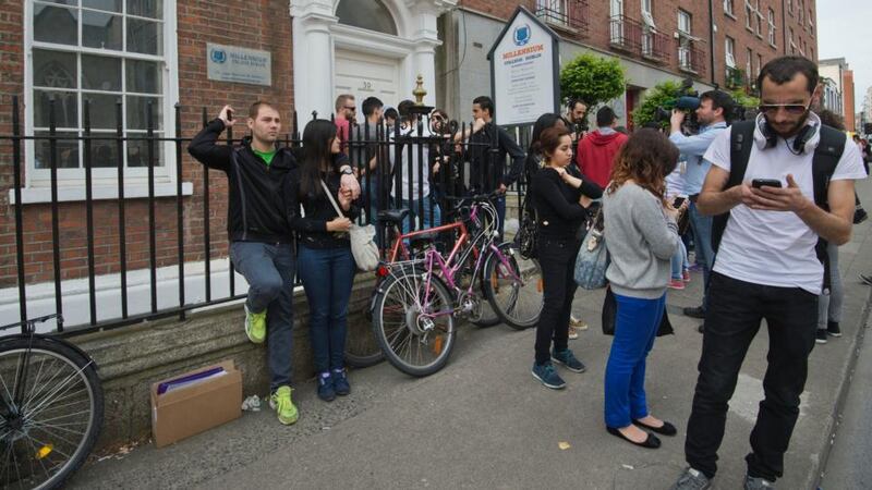 Students outside the closed Millennium College on Dominick Street, Dublin.Photograph: Brenda Fitzsimons/The Irish Times