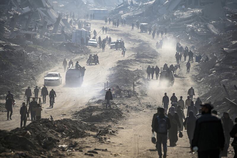 Palestinians walk among the rubble of buildings destroyed in Israeli strikes at Jabaliya refugee camp in northern Gaza. Photograph: Mohammed Saber/EPA