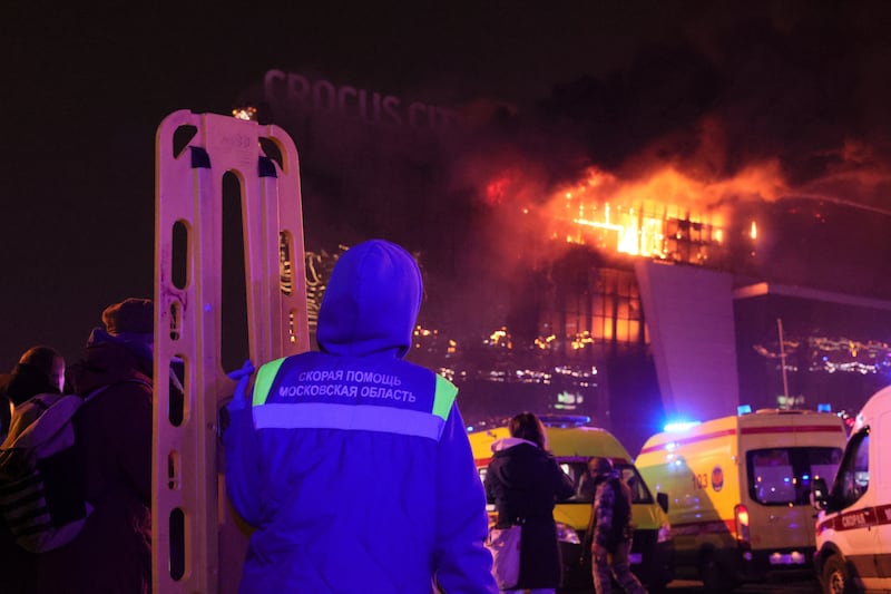 Emergency personnel at the scene of the shooting. Photograph: Vitaly Smolnikov/AP