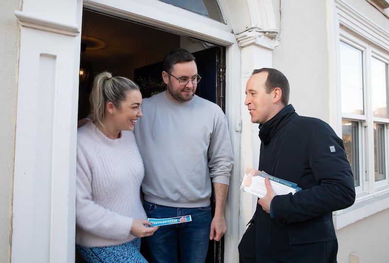 Fine Gael candidate John Cummins talks to Jill and Joe Gallagher on the election canvass in Waterford. Photo: Mary Browne