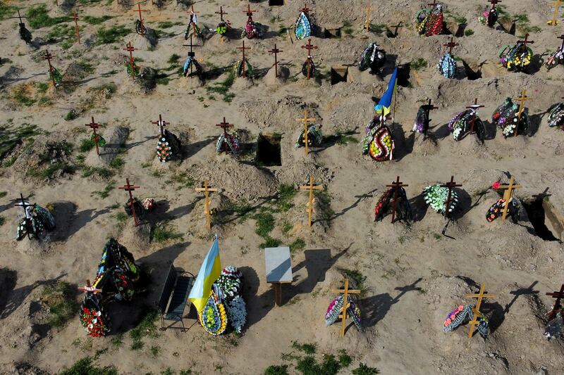 Tombs of people who died after the Russia invasion in Bucha cemetery, on the outskirts of Kyiv. Photograph: AP