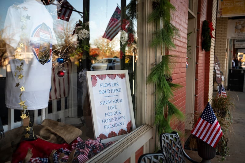 A sign advertises flowers for sale after the death of former US president Jimmy Carter in Plains, Georgia. Photograph: Nicole Craine/New York Times
                      