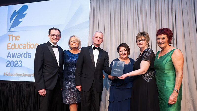 Dr. Ciarán Ó hAnnracháin, awards judge, presents the Best Industry/Business - Academic Collaboration award to ATU, Donegal Campus team