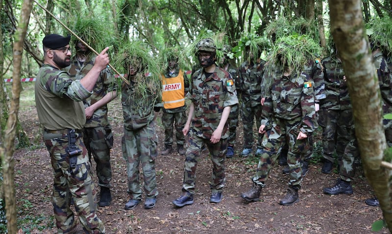 Sgt Massimo Caschera puts participants through their paces with survival, evasion, resistance, escape (SERE) training, and a demonstration on shelter construction. Photograph: Dara Mac Dónaill







