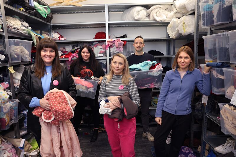 East Wall Here For All volunteers Molly Hennessey, Heather Harte, Roxanna Nic Liam, Jane Dunne and  Paddy O’Dea sort through  donated items for asylum seekers, housed at the old ESB office block in East Wall, Dublin. Photograph: Dara Mac Dónaill 






