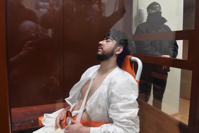 Muhammadsobir Z Fayzov , a suspect in the Crocus City Hall massacre in Moscow, in a defendant's cage as he awaits his pre-trial detention hearing at the Basmanny District Court in Moscow on Monday. Photograph: Olga Maltseva/AFP/Getty