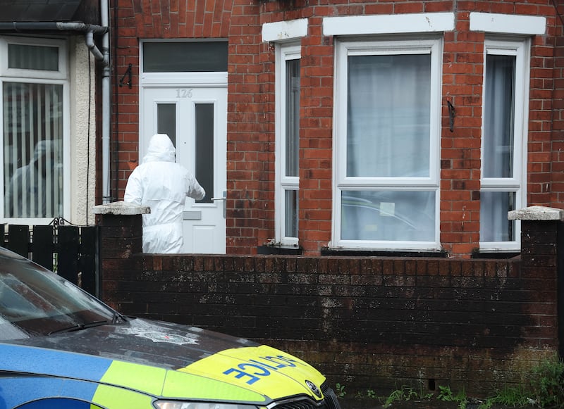 PSNI officers at the scene where Mary Ward's body was found at her home in Melrose Street, Belfast. Photograph: Pacemaker