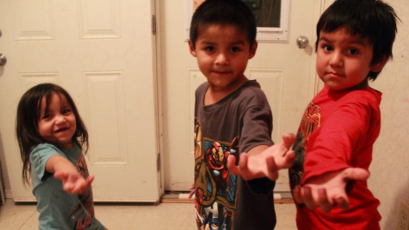 Children in the Turtle household, where 13 people share a three-bedroomed home. Photo: Jennifer Hough