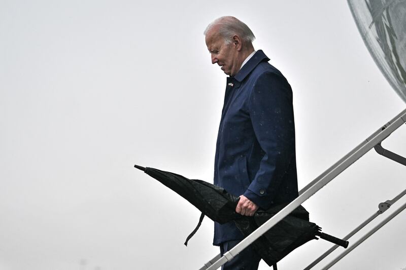 Joe Biden arrives at Dublin Airport, umbrella in hand. Photograph: Jim Watson/AFP