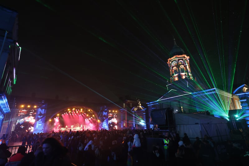 Families and friends gather at Dublin Castle on New Year’s Eve.
Photograph: Dara Mac Dónaill






