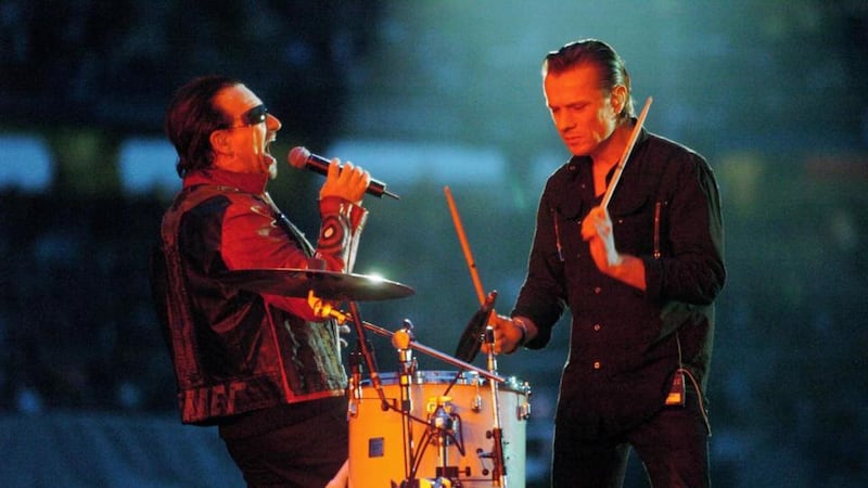 U2’s Larry Mullen performs with Bono on stage during their Vertigo Tour at Croke Park, Dublin. Photograph: Haydn West/PA