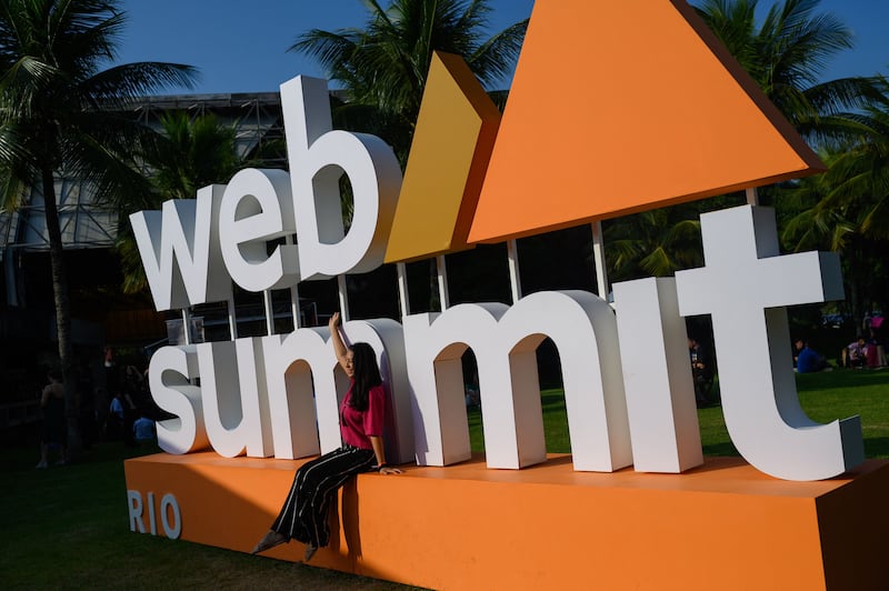 A woman poses for a picture during the second day of Web Summit Rio 2023. Photograph: Mauro Pimentel/AFP/Getty Images