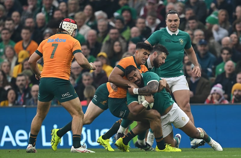 Bundee Aki of Ireland is tackled by Joseph-Aukuso Suaalii of Australia. Photograph: Charles McQuillan/Getty