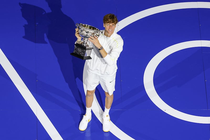 Jannik Sinner with the Norman Brookes Challenge Cup trophy after winning the men's singles final at the Australian Open. Photograph: Adrian Dennis/AFP via Getty Images