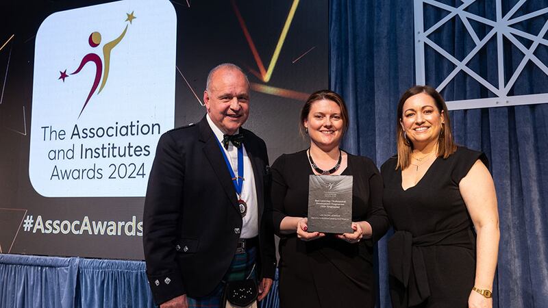 Steve Mungavin, awards judge, presents the best learning / professional development programme (under 100 employees) awards to Paula Hodson and  Anne McGlynn, Insurance Institute of Ireland