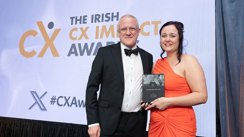 Tim Farmer, awards judge, presents the CX rising star of the year award to Amy Collins, Bus Éireann