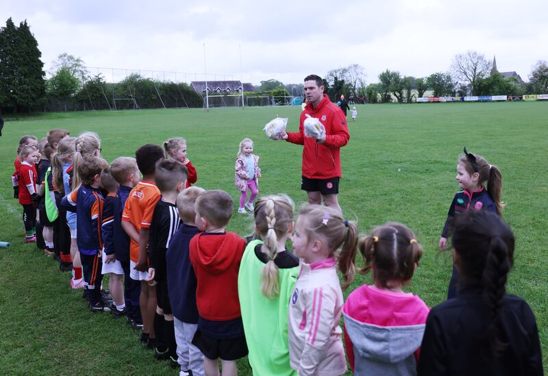 Player and Coach Paul Carvill with young footballers at Tir na nÓg GAA club in Portadown Co. Armagh on Saturday. Photo: Bryan O Brien / The Irish Times 
