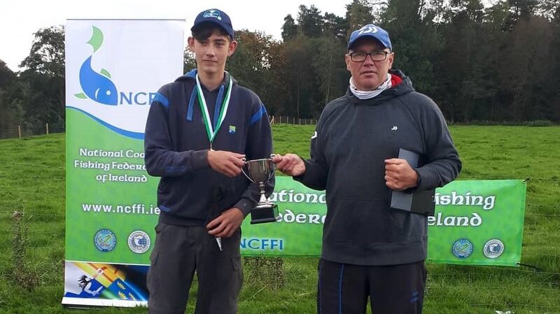 Charlie Richards,  winner of U-15 Youth Feeder Championships on the Lower River Bann, receiving his prize from team manager Brenton Sweeney