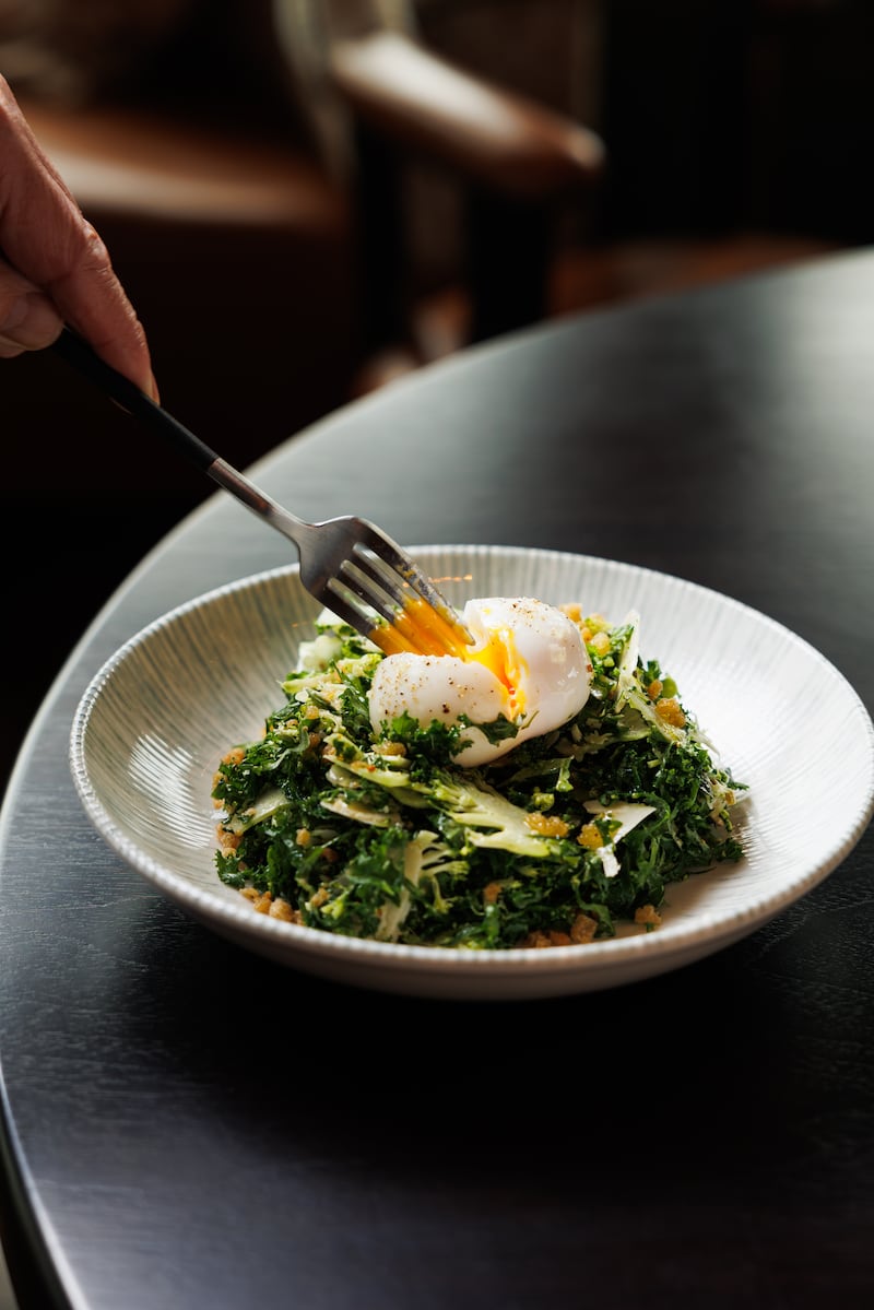 The tasting menu opens with egg toast, caviar and herbs