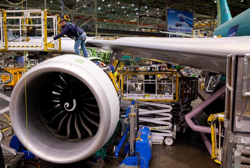 The engine being mounted to the plane. Photograph: Lindsey Wasson/The New York Times