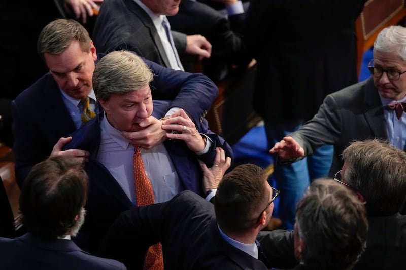 US Congress: Richard Hudson restrains Mike Rogers as they talk to Matt Gaetz. Photograph: Andrew Harnik/AP