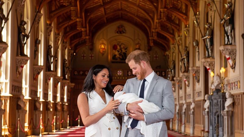 Prince Harry (R) and Meghan Markle, the Duchess of Sussex, pose together with their newborn son. Photograph:  Dominic Lipinski /EPA/ PA