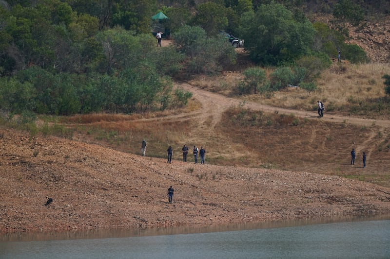 Personnel at Barragem do Arade reservoir, in the Algave, Portugal, as searches begin as part of the investigation into the disappearance of Madeleine McCann. Photograph: Yui Mok/PA Wire 