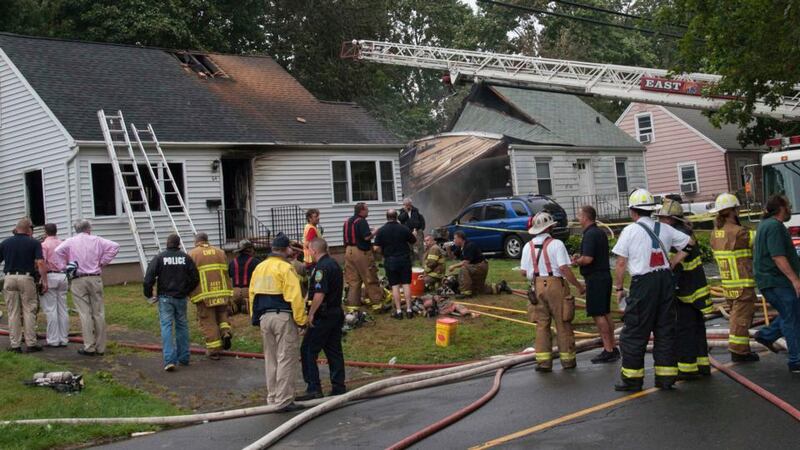 Fire and rescue personnel surround the site of a plane crash in East Haven, Connecticut yesterday. Photograph: Glenn Duda/Reuters