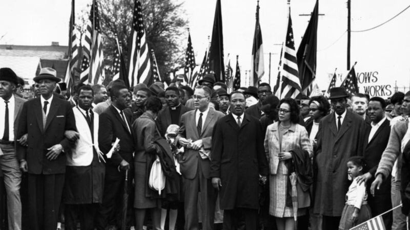 Civil rights campaigner Dr Martin Luther King Jr with his wife Coretta Scott King, at a black voting rights march from Selma, Alabama, to the state capital in Montgomery in March, 1965. Photograph:  William Lovelace/Express/Getty Images