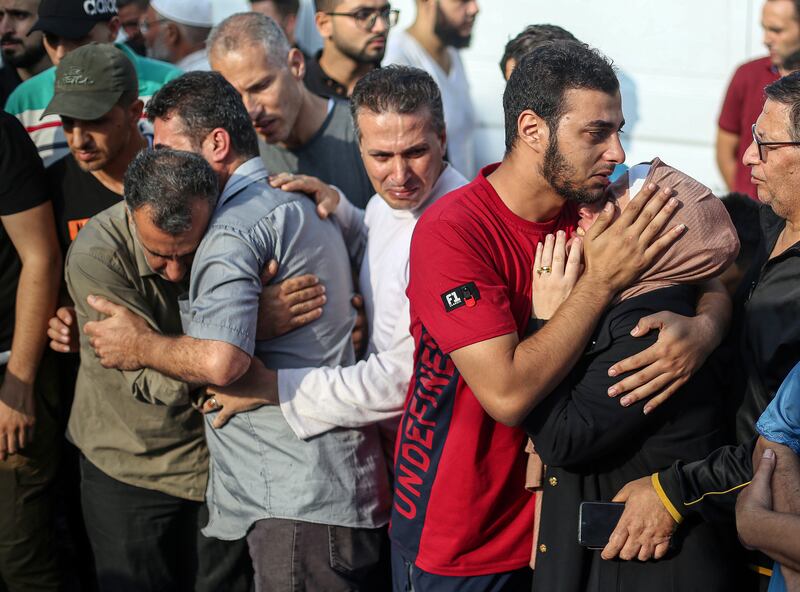 People grieve for loved ones who were killed in an Israeli air strike during a funeral in Khan Younis on Tuesday. Photograph: Yousef Masoud/New York Times
                      