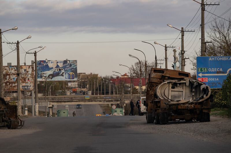 A burned-out Russian military vehicle in Kherson, near the destroyed Antonivsky Bridge across the Dnipro River. Photograph: Lynsey Addario/New York Times