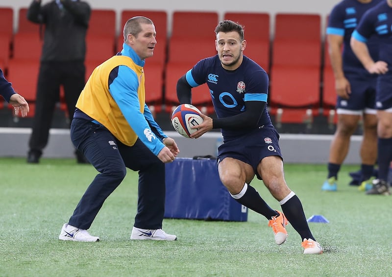 Danny Care moves past head coach Stuart Lancaster during an England training session at St George's Park in February 2014. Photograph: David Rogers/Getty Images