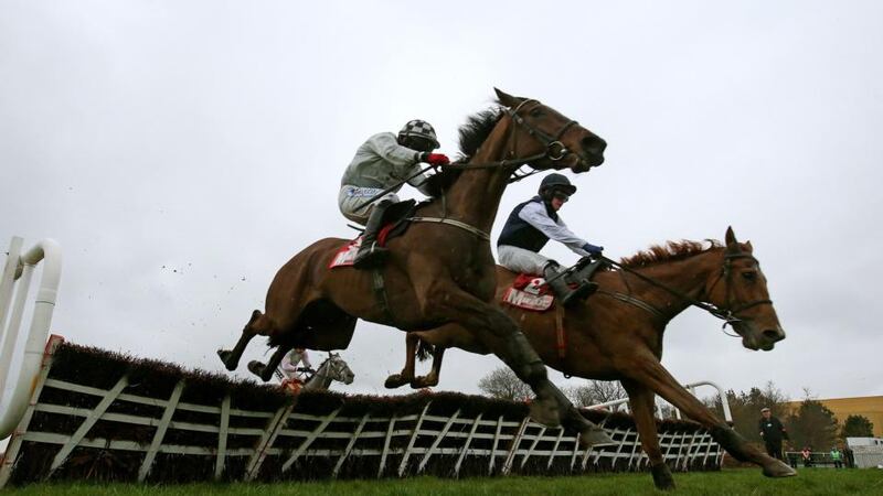 Morning Assembly under jockey Davy Condon (left) jumps the last to win ahead of Inish Island under jockey Paul Townend during the Irish Daily Mirror Novice Hurdle  at Punchestown. Photograph: Julien Behal/PA Wire