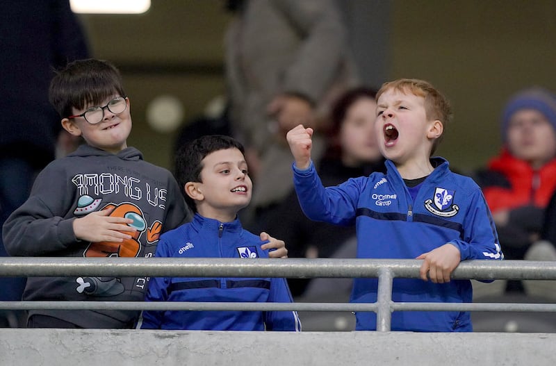 Young Sarsfields fans cheers on their side. Photograph: James Lawlor/Inpho