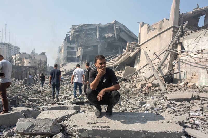 Residents gather to view the destruction following Israeli air strikes on the Al-Rimal neighbourhood of Gaza City on Tuesday. Photograph: Samar Abu Elouf/New York Times