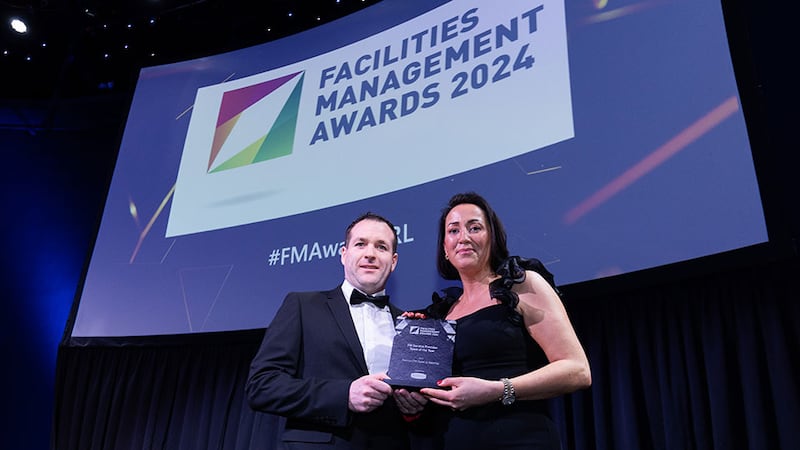 Martin McNally, head of smoke ventilation & service of Williaam Cox, presents the FM service provider team of the year award to Deirdre McGrath, Sensori FM