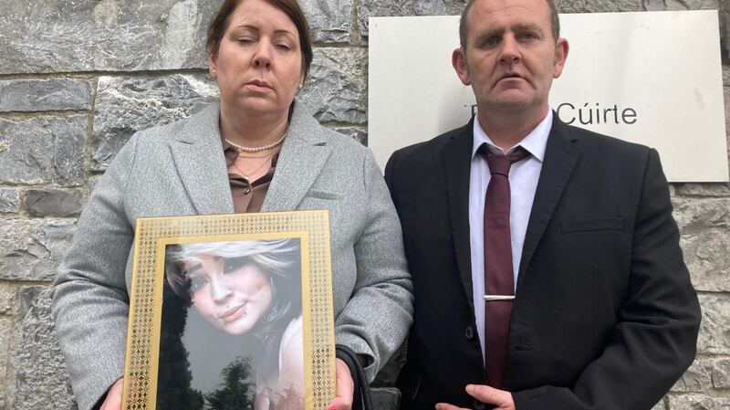 Melanie Sheehan and Barry Cleary hold a photograph of their daughter Eve Cleary outside Limerick Coroners Court. Photograph: David Raleigh