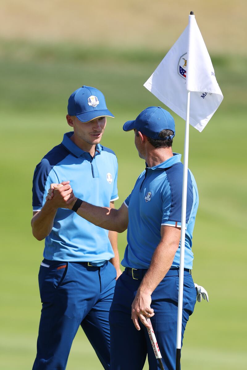 Nicolai Højgaard and Rory McIlroy of Team Europe during a practice round at the Ryder Cup. Photograph: Richard Heathcote/Getty