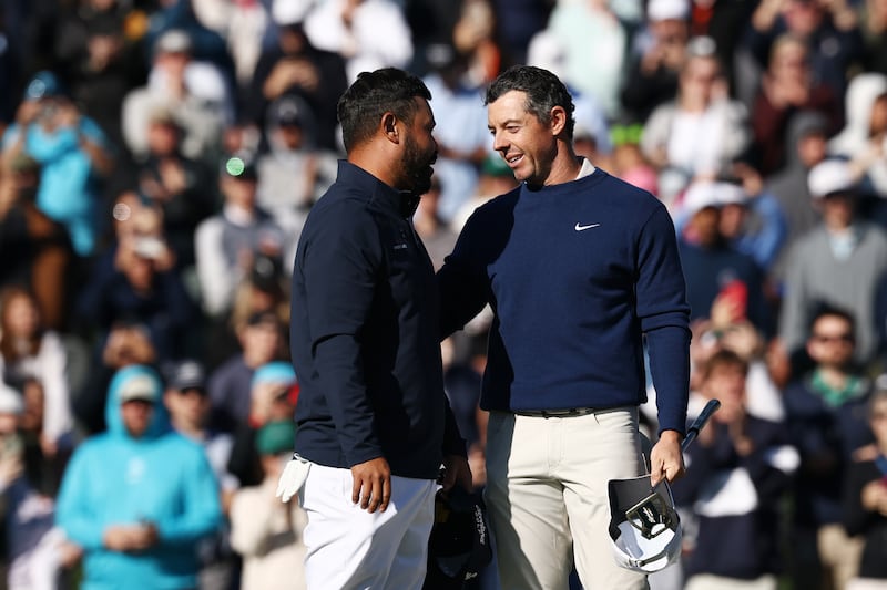 JJ Spaun and Rory McIlroy on the 18th green after McIlroy's win. Photograph: Jared C Tilton/Getty Images