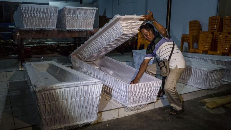 A man prepares coffins before loading them into a truck ahead of the executions of the Bali 9, at Java Christian Church on April 26, 2015 in Cilacap, Central Java, Indonesia. The execution could be held as soon as Tuesday midnight on Nusukamban Island where they have been held, awaiting their fate since March 4th, 2015. Photograph: Ulet Ifansasti/Getty Images