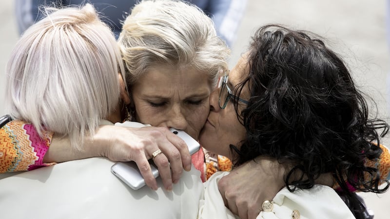 Mary Moran, centre, is hugged by her sisters Bridget O’Reilly and Anne O’Reilly. Photograph: Tom Honan