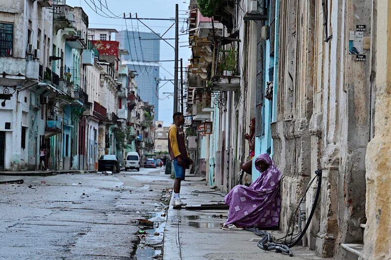 People remain in the street during a nationwide blackout caused by a grid failure in Havana, on October 19th. Photograph: Adalberto Roque/AFP via Getty Images