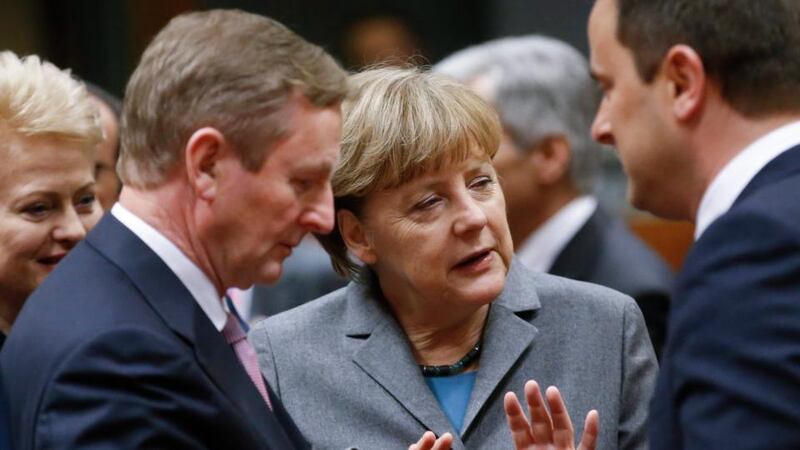 German  Chancellor Angela Merkel (centre), Taoiseach  Enda Kenny (left) and Luxembourg’s prime minister Xavier Bettel talk  at the start of European summit of heads of states and government at EU Council headquarters in Brussels on Thursday. Photograph: EPA