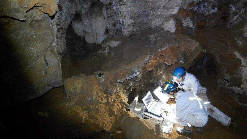 Scientists at work in the cave where the recent Homo naledi remains where found in Johannesburg, South Africa. Photograph: EPA